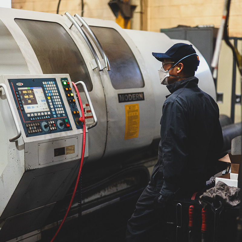 Worker with Metal Machine