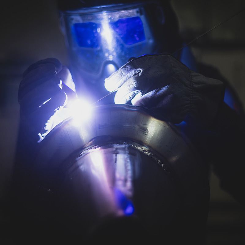Person Welding in Mask
